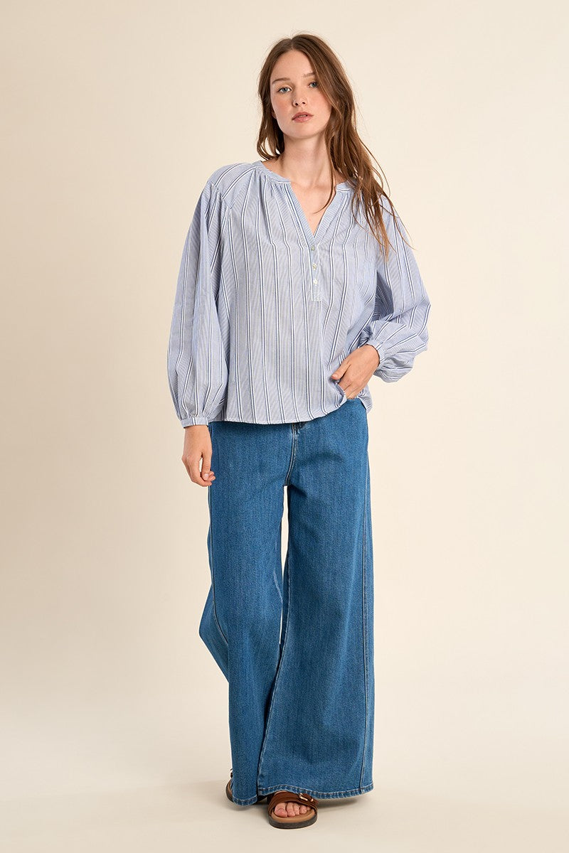 Maxine ladies woven blouse in light blue cotton with a subtle pattern and relaxed silhouette.