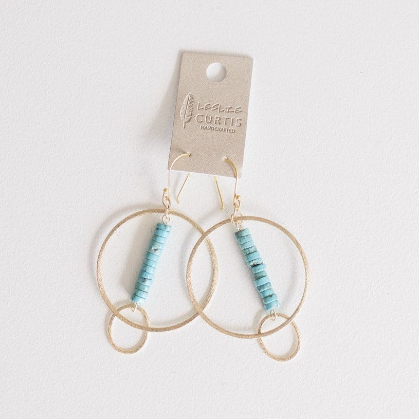 Turquoise heishi bead hoop earrings on a two-inch bar.