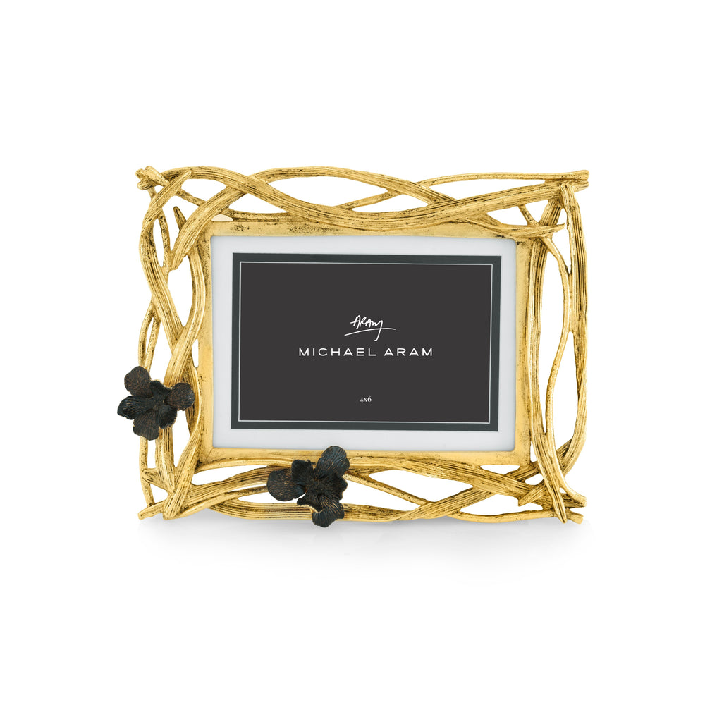 Goldtone oxidized rectangular photo frame with black iris motif holding a vertical 4x6 inch photograph.