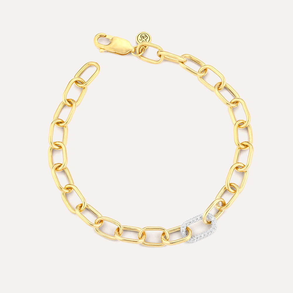 Gold link chain bracelet featuring a single diamond-encrusted link and a lobster clasp closure.