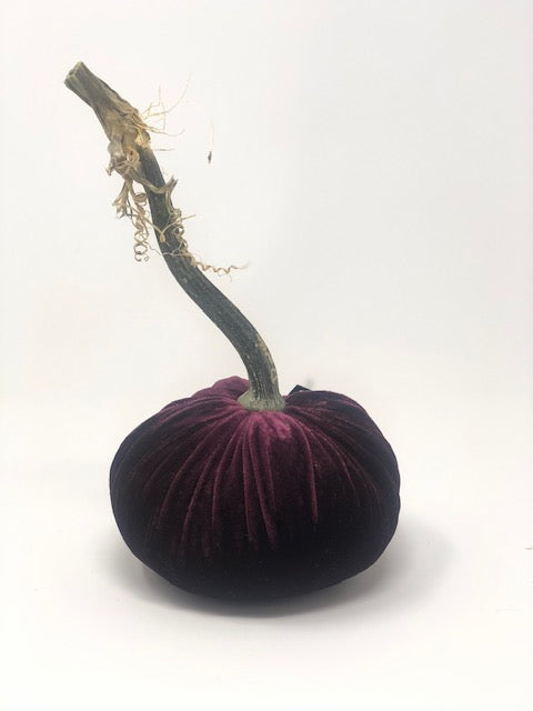 Handmade orange velvet pumpkin with a natural stem.