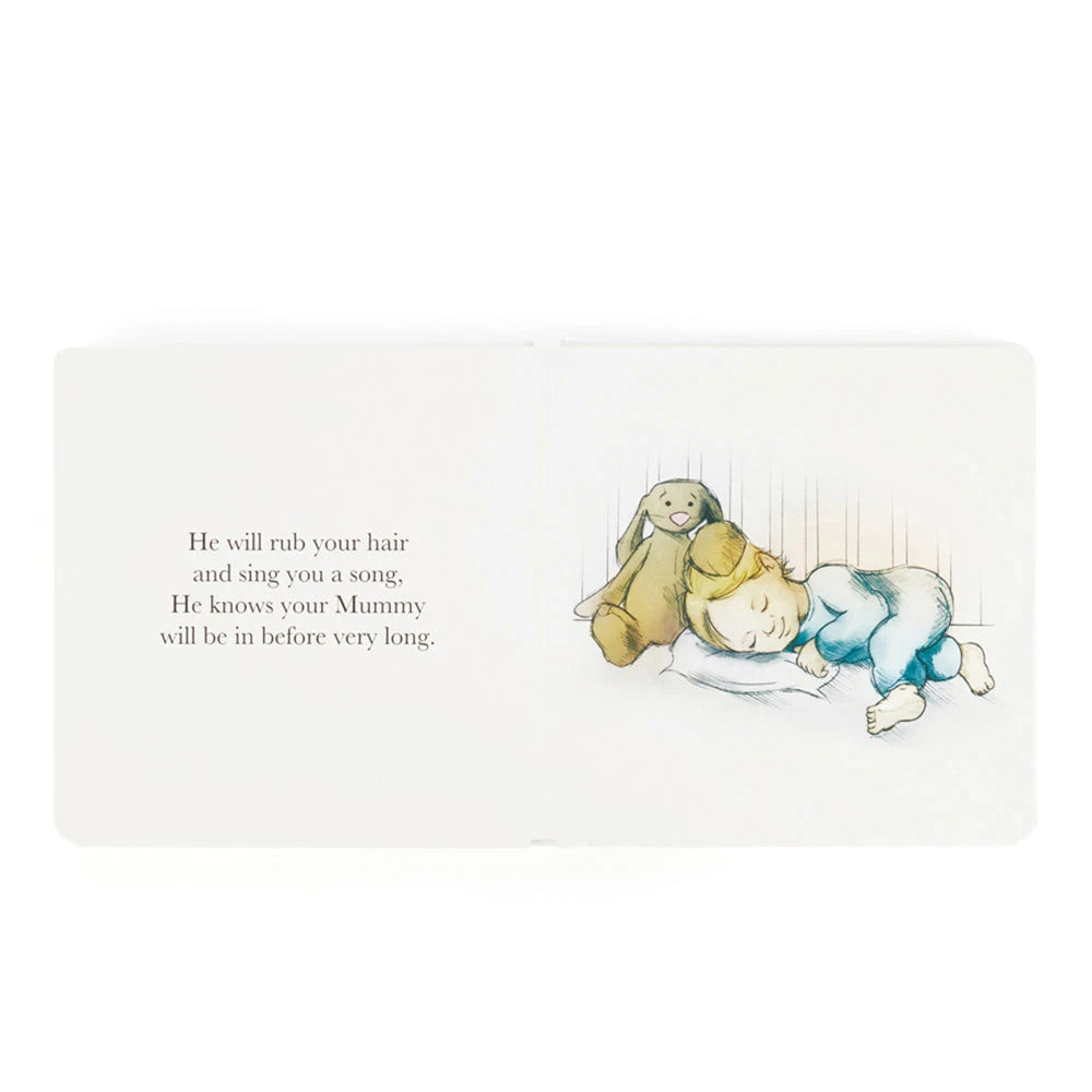 Open page of The Magic Bunny Book showing a sleeping child with a Bashful Cottontail Bunny toy.
