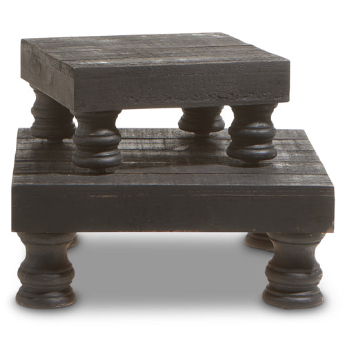 Black wood footed risers with round knobs on each leg.