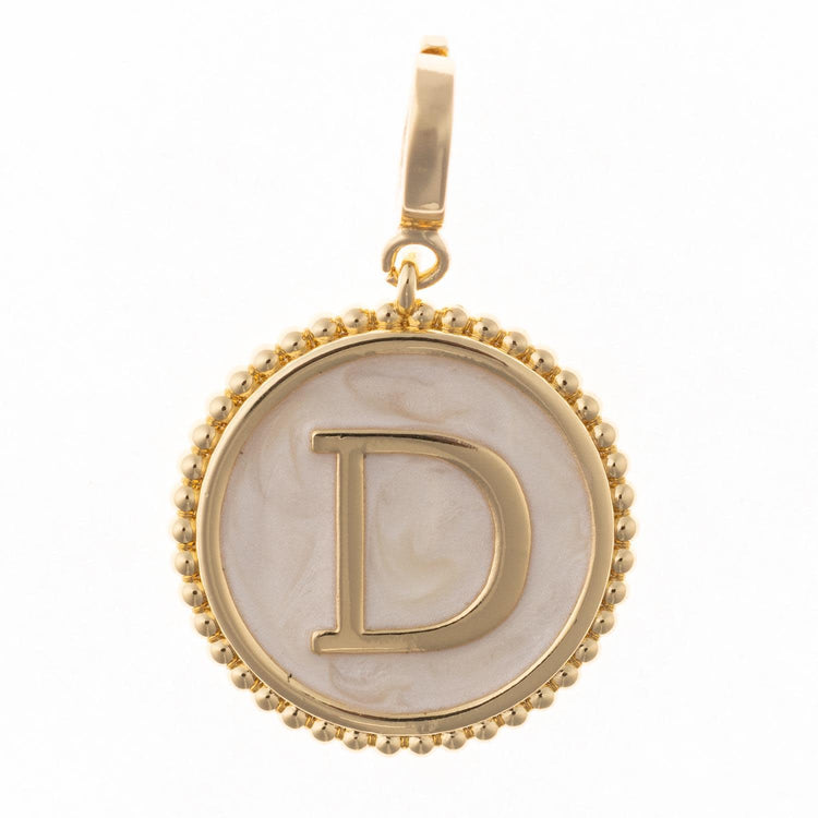 Circular .5-inch charm in 18k gold plating with faux mother-of-pearl inlay and clasp.