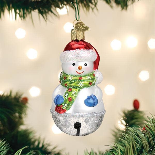 Mouth-blown glass snowman ornament with silver accents, hand-painted red hat and scarf, glittered details.