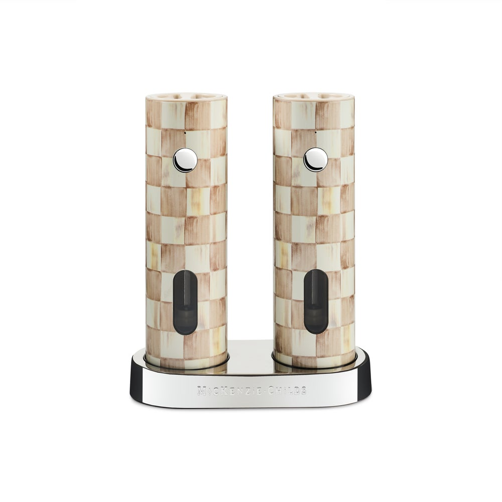 Mocha Check Electric Salt & Pepper Grinder Set on a stainless steel charging base.