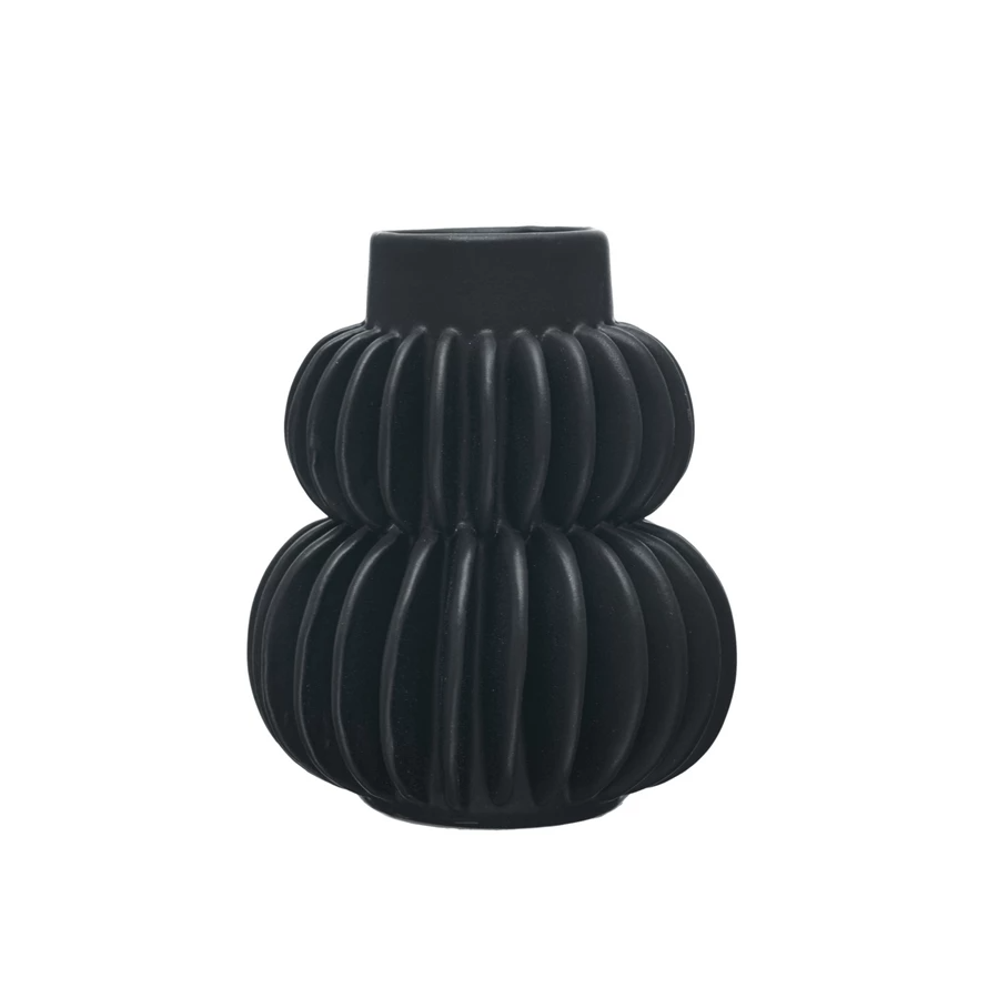 Handmade pleated stoneware vase with a textured ribbed surface in neutral earth tones.