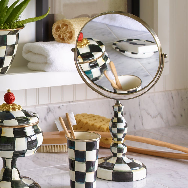 Hand-glazed enamel vanity mirror with stainless steel frame featuring a courtly check pattern.