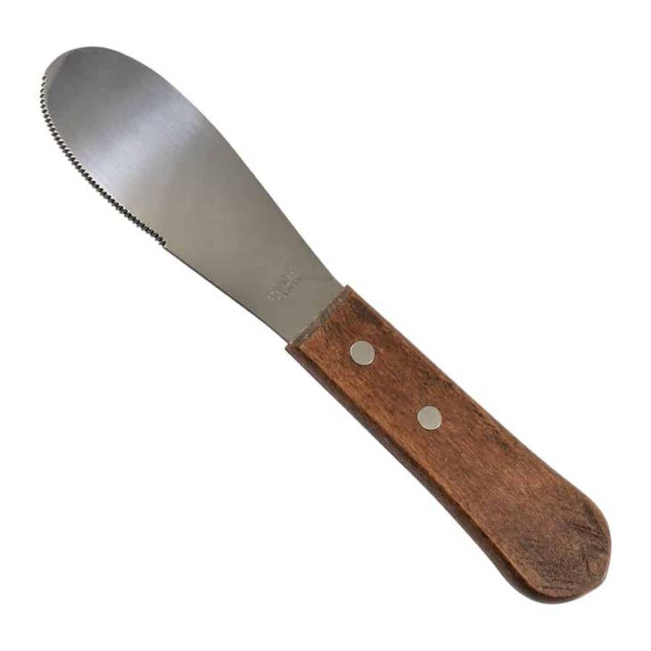 Stainless steel sandwich spreader with a serrated edge and a wooden handle secured by two rivets.
