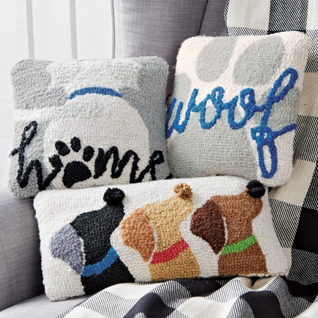 Mini hooked dog pillow in woof brown with a playful bone pattern.