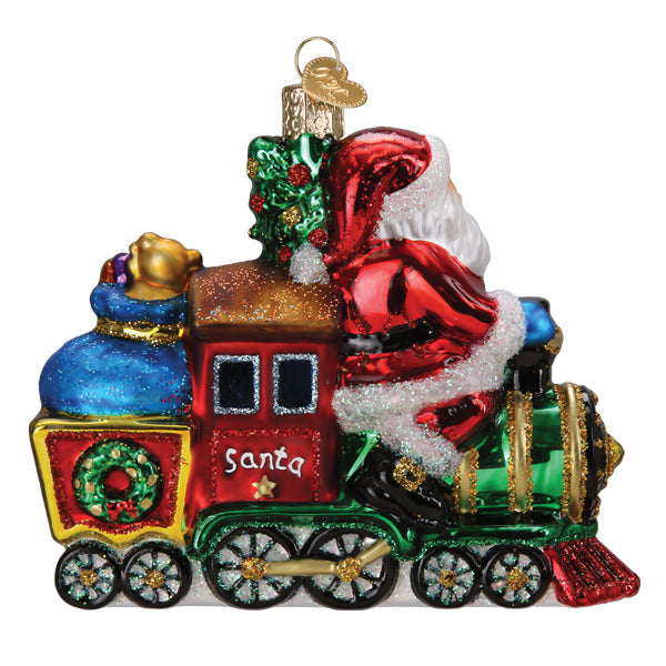 Glass Christmas ornament of Santa Claus driving a colorful red and green locomotive train.