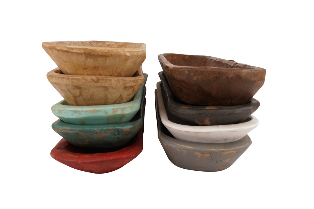 Two stacks of small, rustic wooden baguette bread bowls in various colors and finishes.