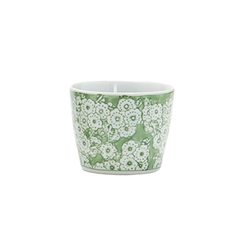 Small green and white porcelain cachepot with a dense floral pattern.