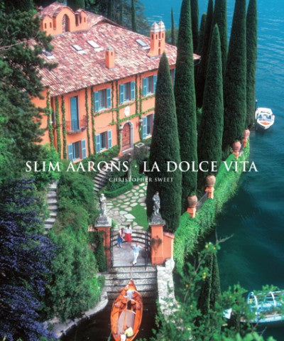 Book cover for "Slim Aarons: La Dolce Vita" featuring an Italian villa by a lake.