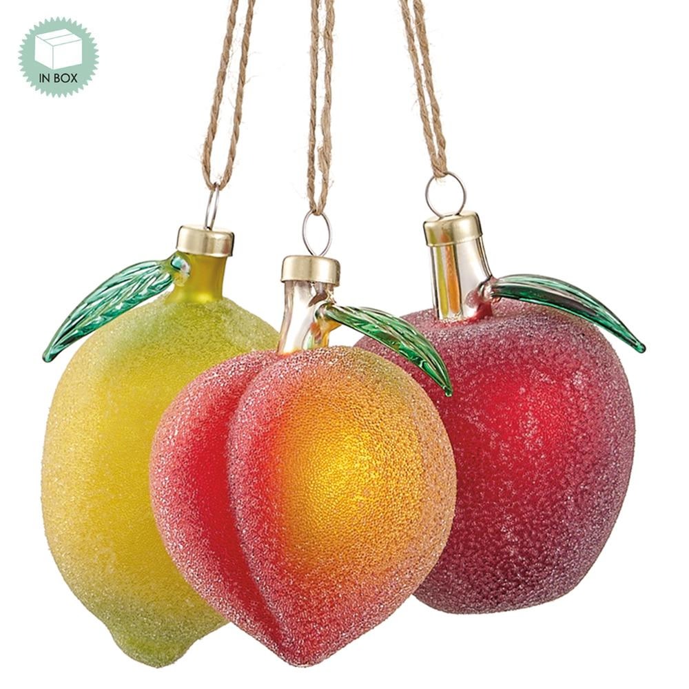 Set of three frosted glass fruit ornaments including a yellow lemon, orange peach, and red apple.