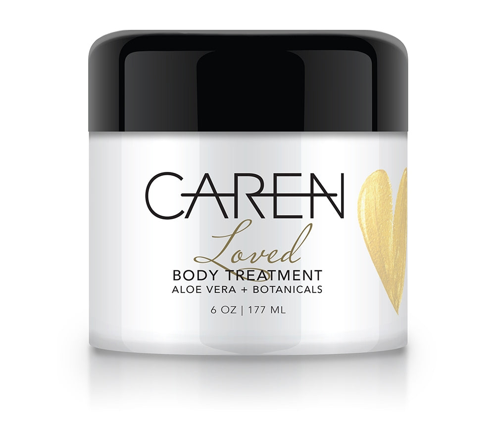 6oz Loved Body Treatment in a white glass jar with a black lid and gold heart detail.