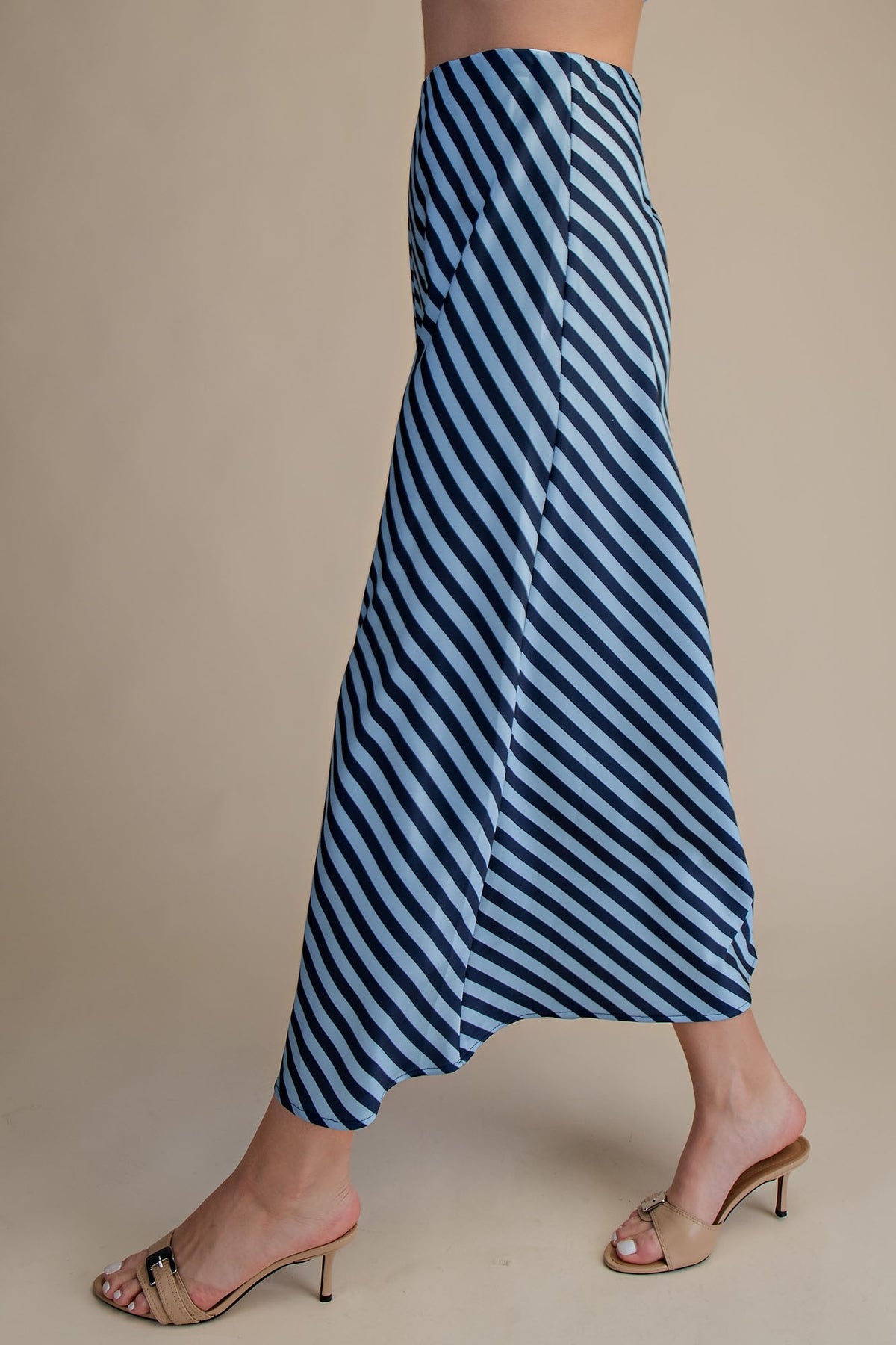 Ella waist elastic band midi skirt in solid black polyester with a straight silhouette.