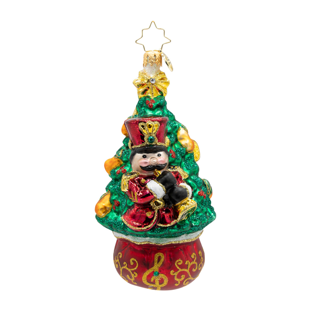 11 Pipers Piping Tree glass Christmas ornament featuring a nutcracker piper on a green tree.