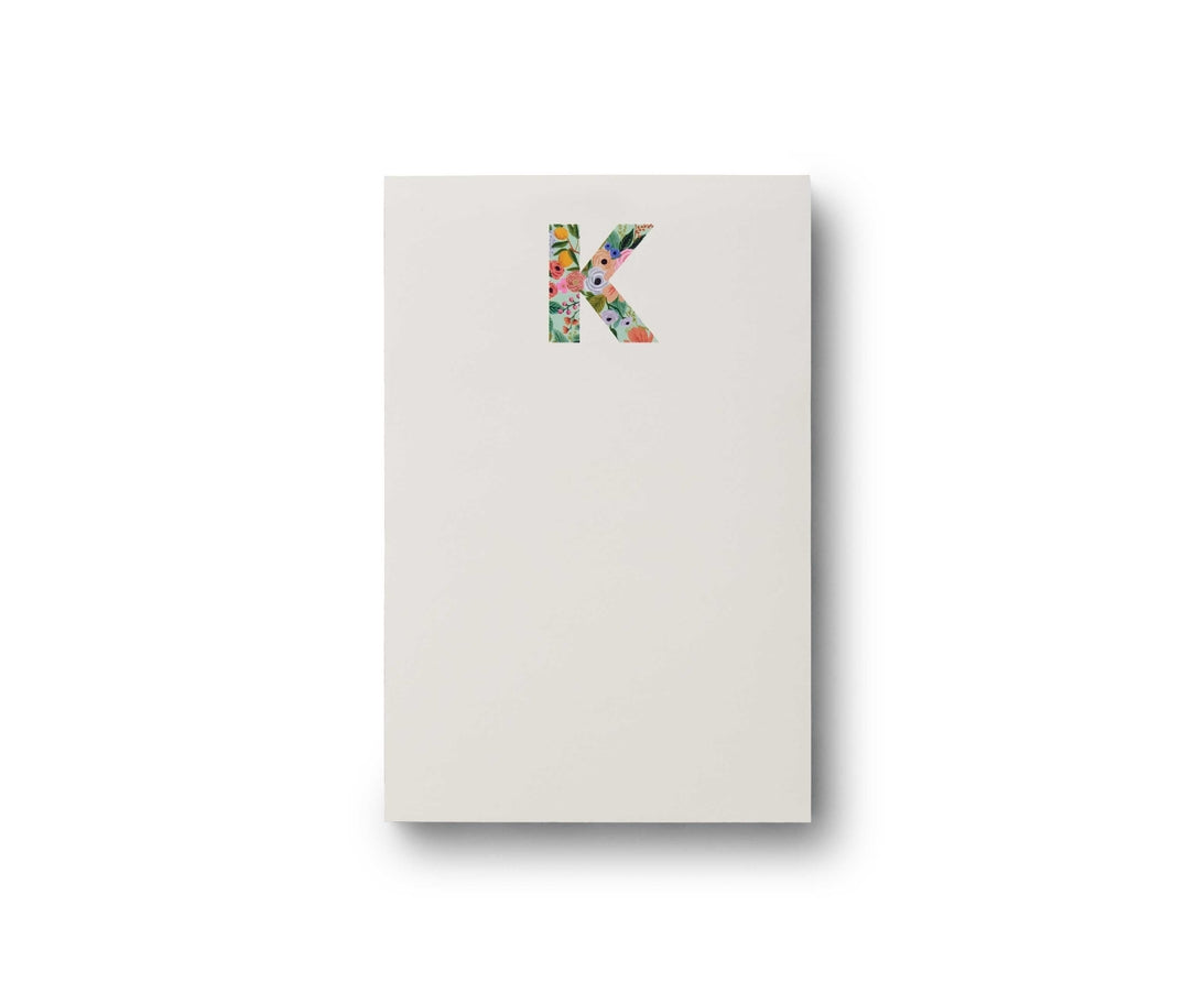 Garden Party monogram notepad with tear-off sheets in a floral pattern.