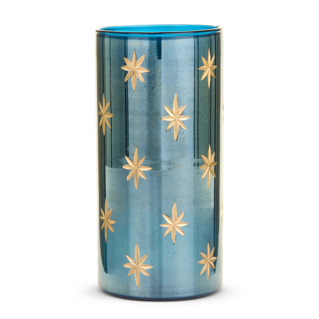 Cylindrical blue glass container with etched gold star patterns.