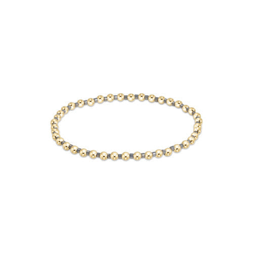 Hope Grateful bracelet featuring mixed 2mm seed beads in spring colors with gold-filled accents on elastic cord.