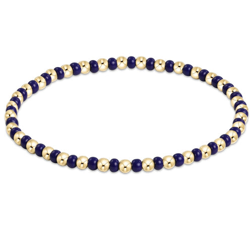Hope Grateful bracelet featuring mixed 2mm seed beads in spring colors with gold-filled accents on elastic cord.