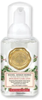 Michel Design Works Holiday Garland Foaming Shea Butter Hand Soap in a mini 4.7 fl oz pump bottle.