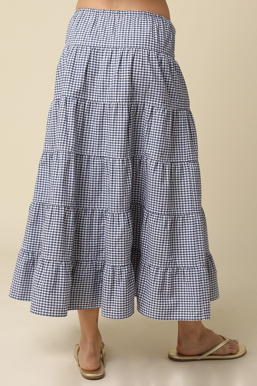 Jasmine Gingham Drawstring Tiered Maxi Skirt in navy and white with a flowy tiered silhouette.