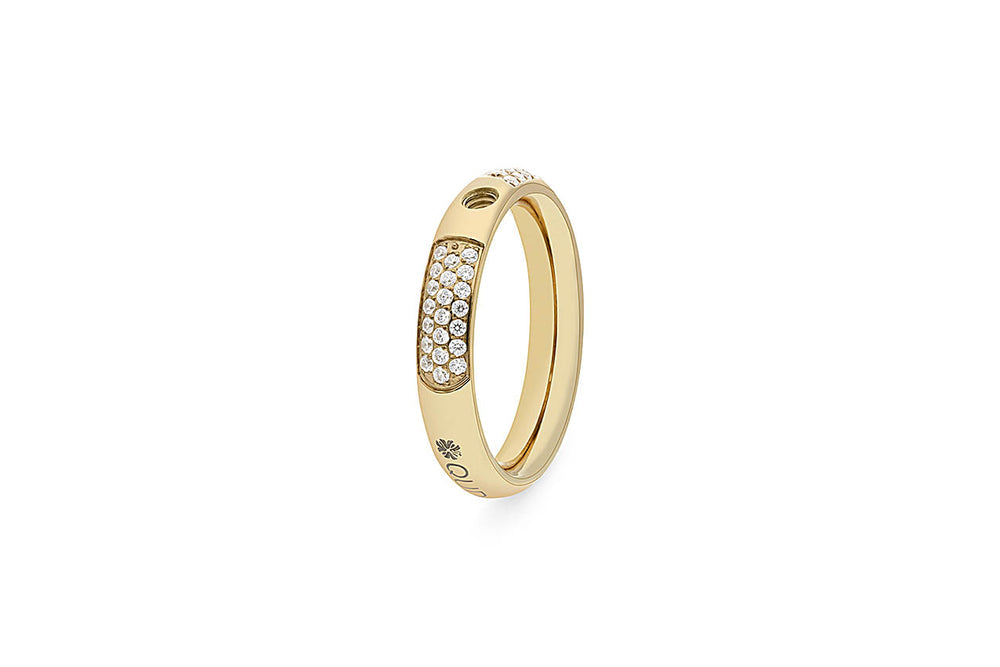 Gold ring with pave diamonds on a curved section and engraved markings.