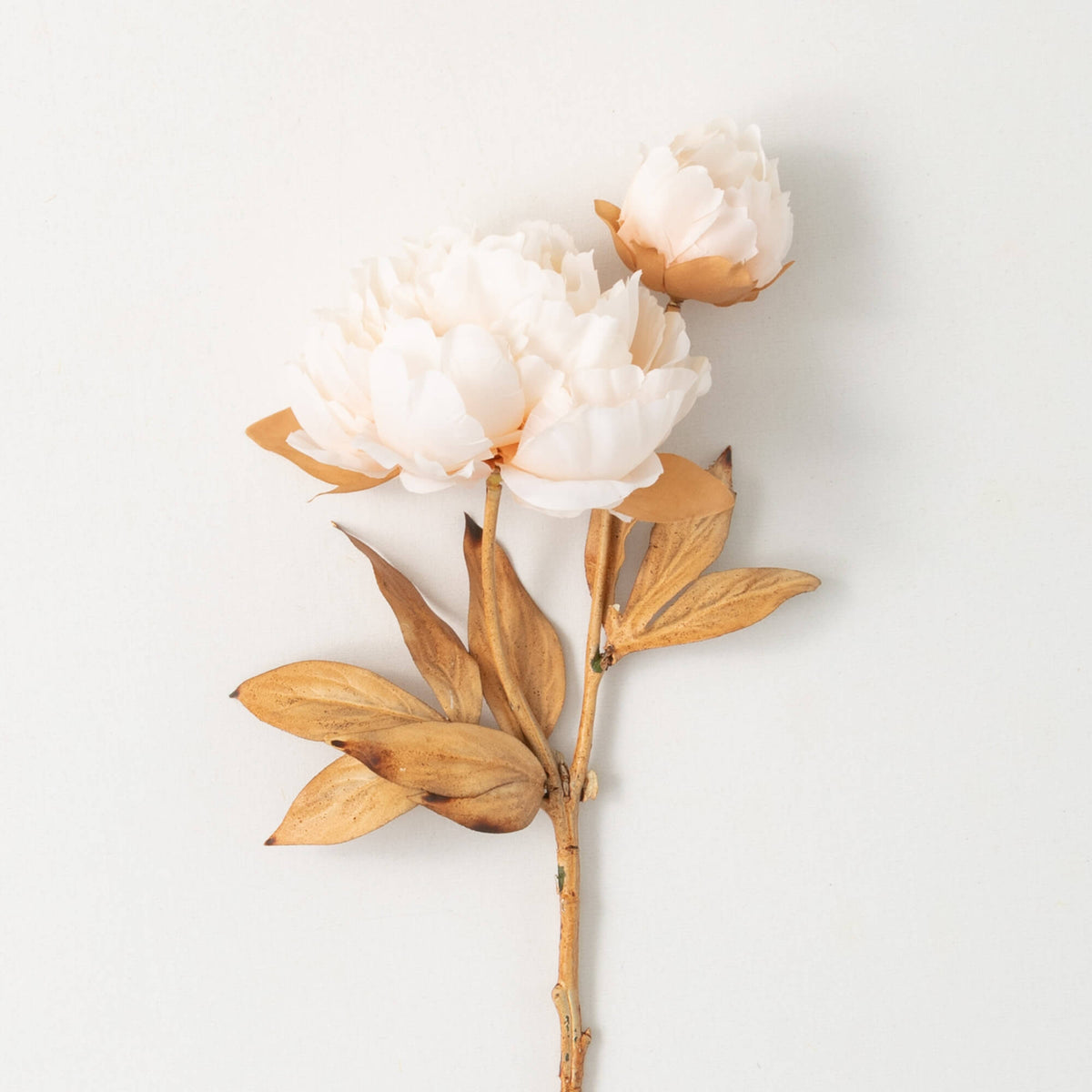 Cream polyester artificial peony arrangement with a classic blooming floral pattern.