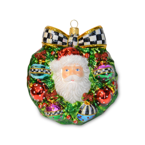 Santa Wreath Glass Ornament with a black and white checkered bow and colorful ornaments.