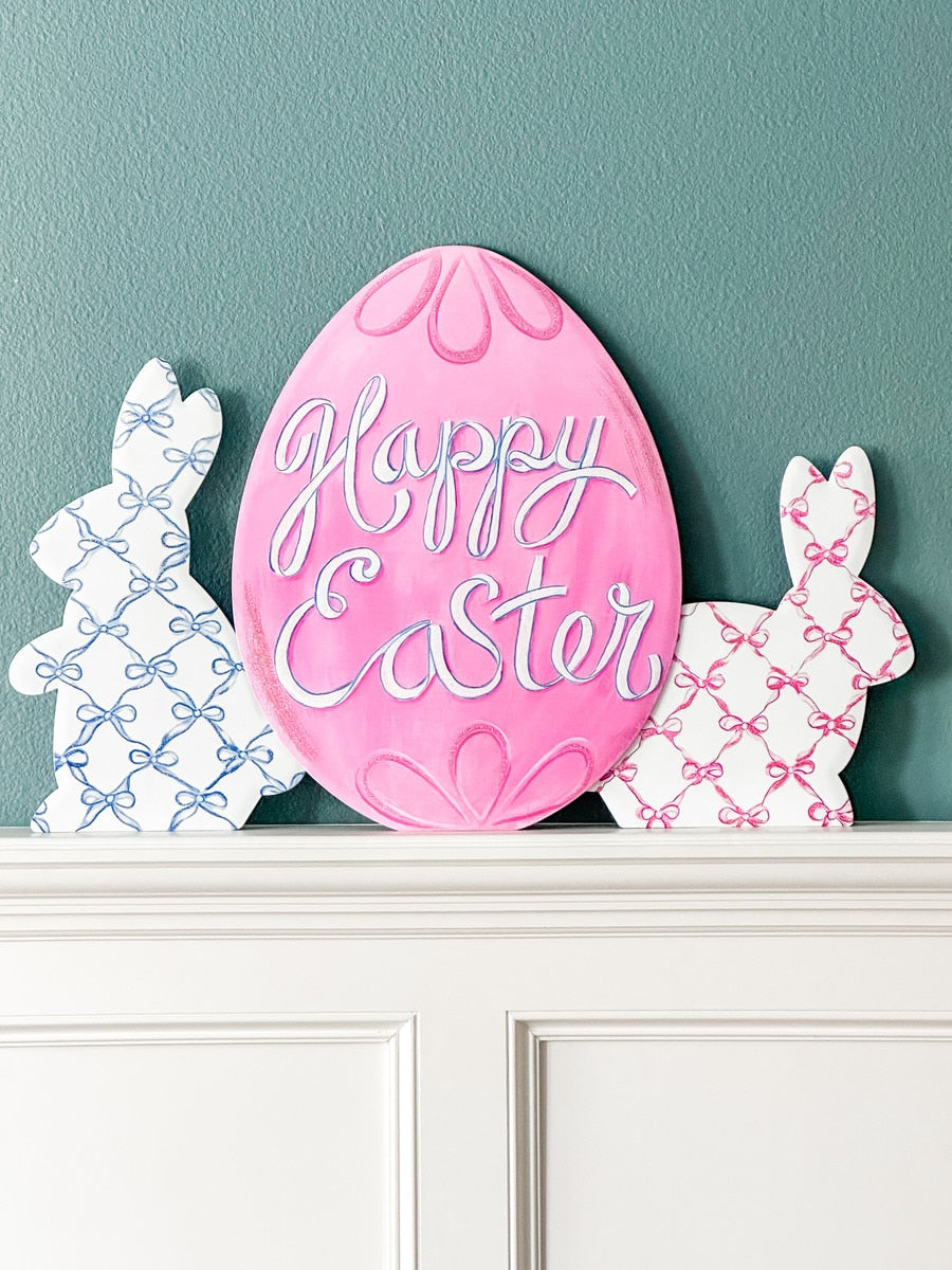 Bowtiful Bunnies easel stake featuring a white bunny silhouette with pink bow accents on a natural wood finish.