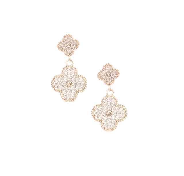 Double clover-shaped dangle earrings with shimmering pave-set cubic zirconia stones.