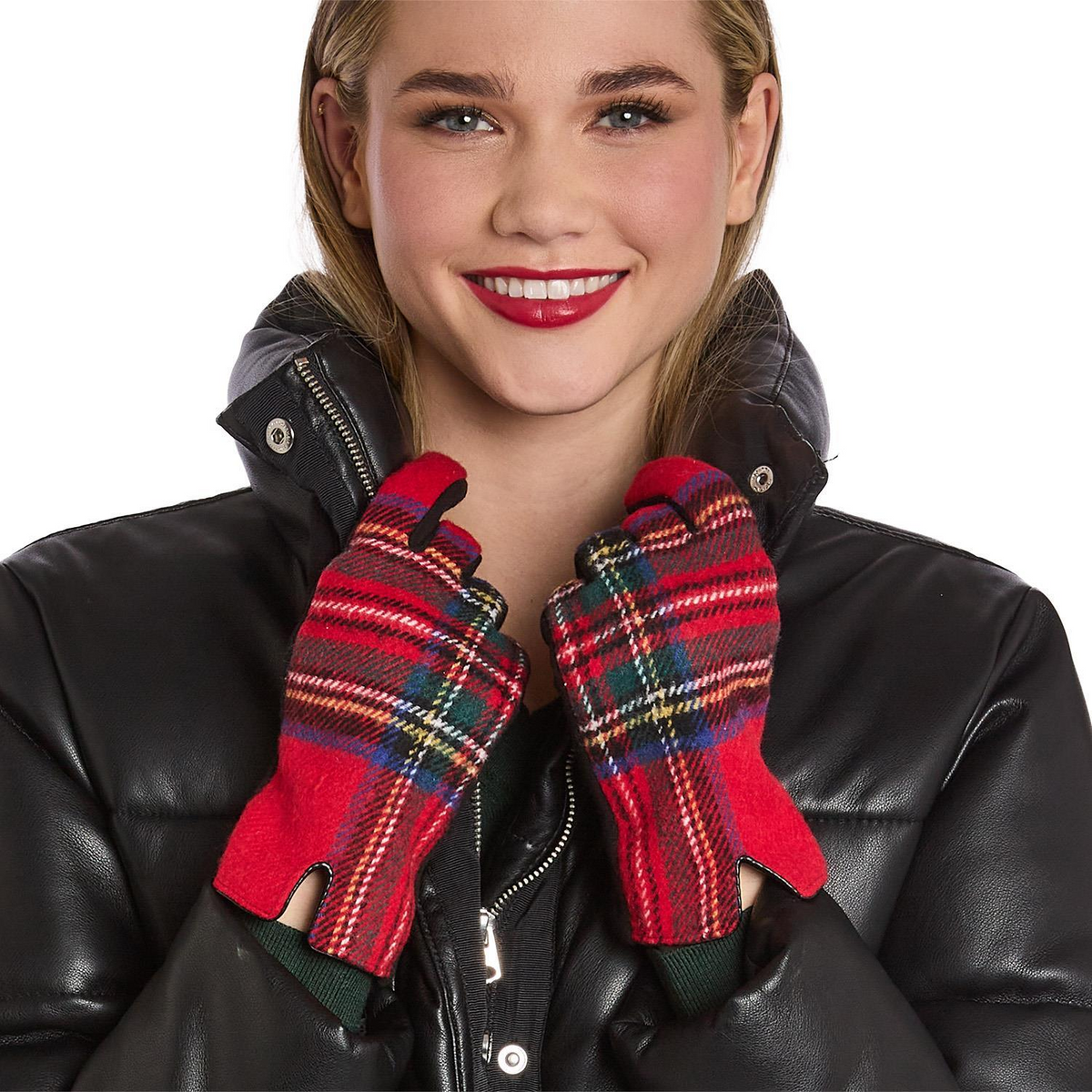 Woman wearing red tartan gloves with microsuede palms and a black leather jacket.