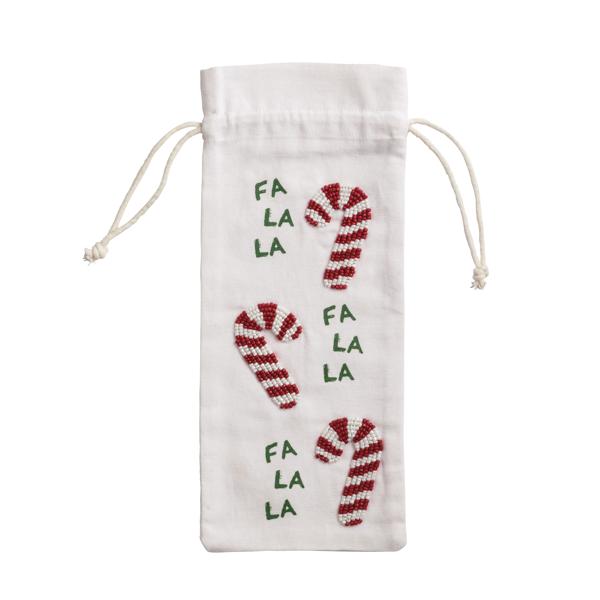 Beaded wine bag with cotton exterior in a neutral tone.