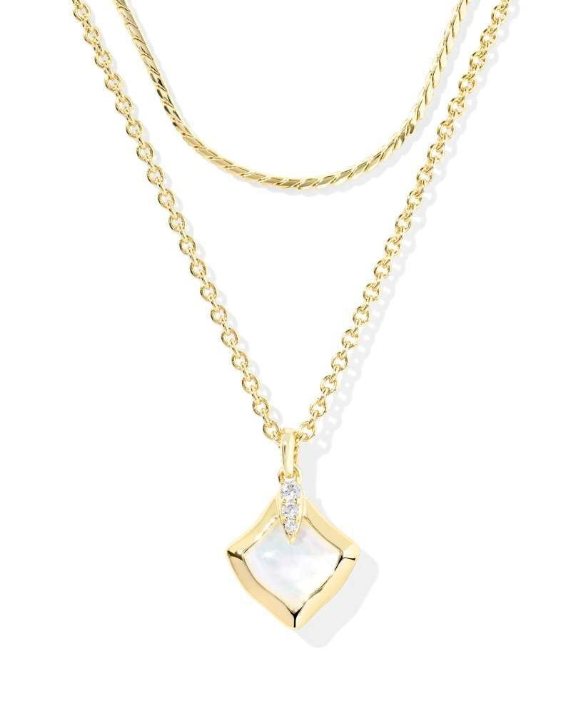 Gold multi-strand necklace with ivory mother-of-pearl pendant on adjustable chain.