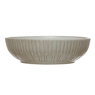 Debossed white stoneware bowl with a vertical textured pattern and a 13-inch round diameter.