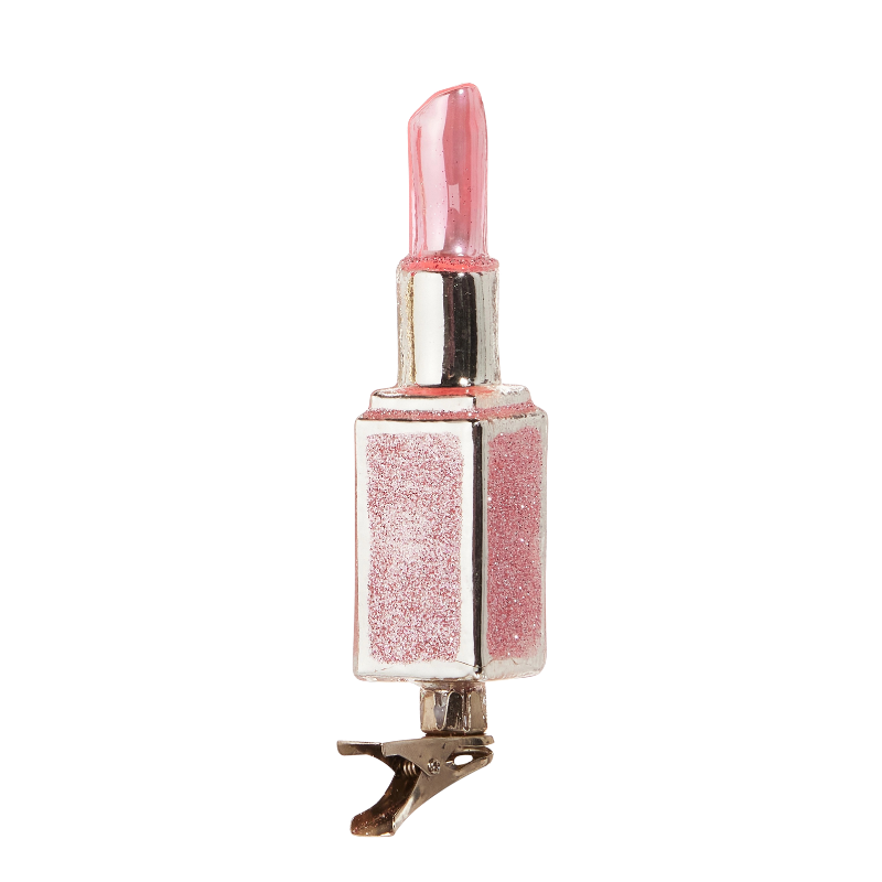 Pink glittery lipstick glass clip-on Christmas ornament with silver accents.