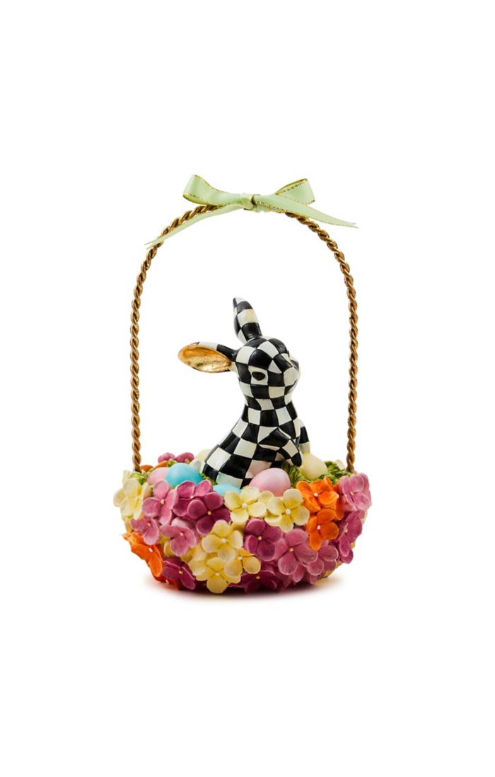 Checkered bunny figurine sitting in a colorful hydrangea flower basket with a gold handle and bow.