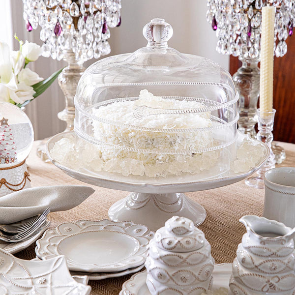 Berry & Thread whitewash ceramic cake stand with a glass dome on a set table.