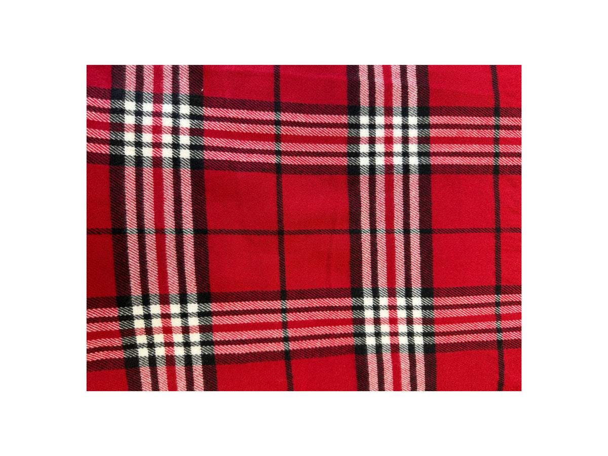 Close-up of a red Scottish plaid cashmere scarf with black and white checkered patterns.