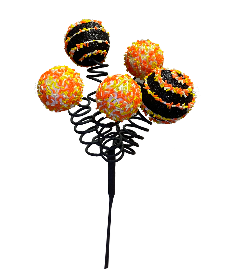 Black curly cake pop sprinkles with sparkly coating arranged in a bouquet-style display.