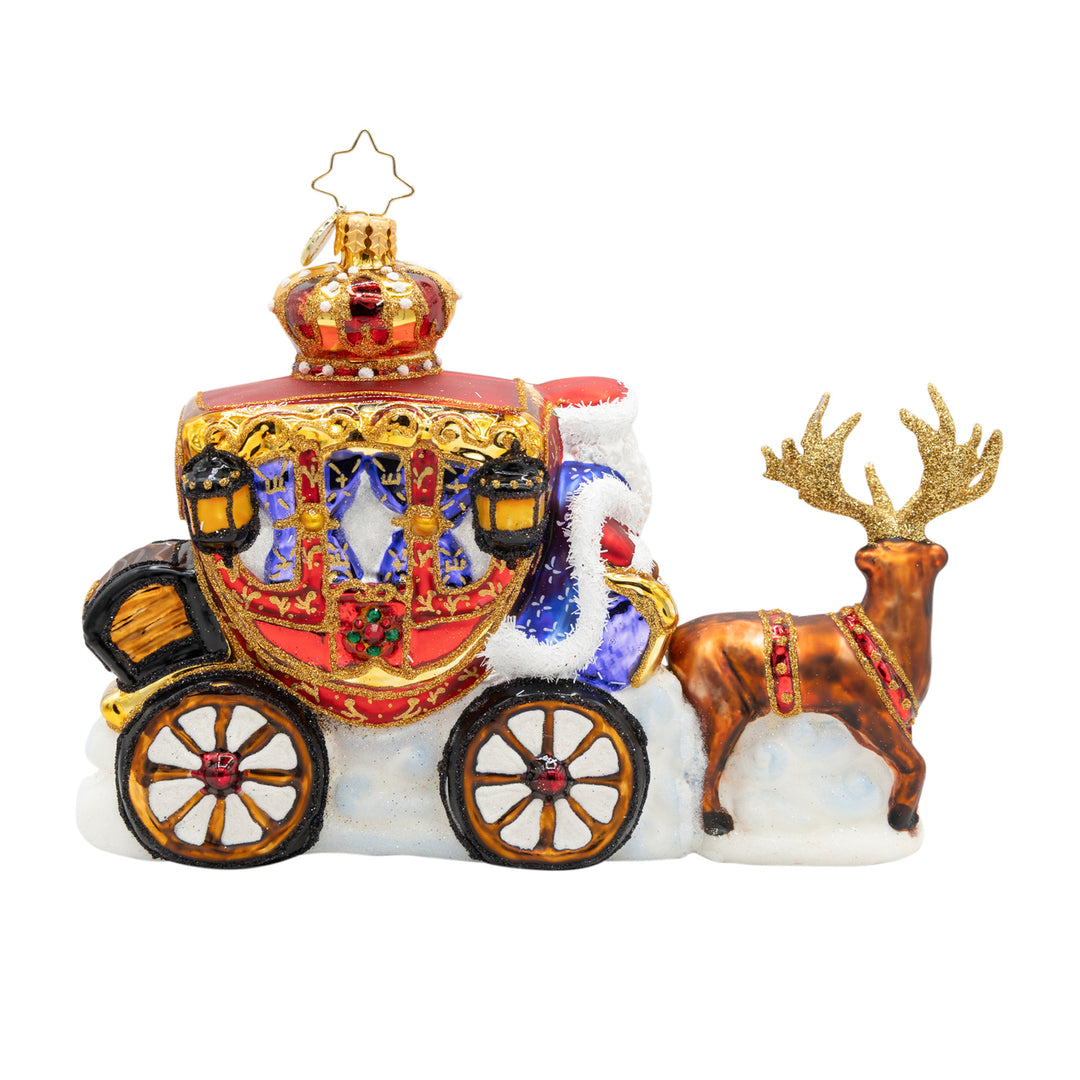 Yuletide Carriage Ride glass ornament featuring Santa in a red and gold carriage pulled by reindeer.