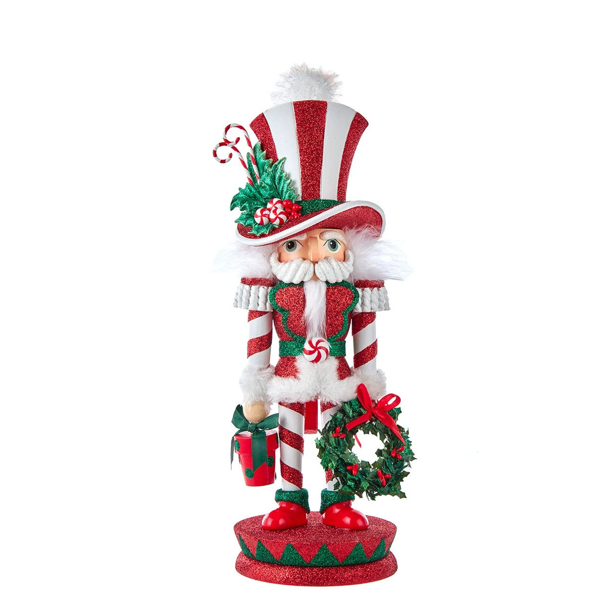 15-inch Hollywood Mr. Christmas Nutcracker in red and white stripes with a wreath and gift box.