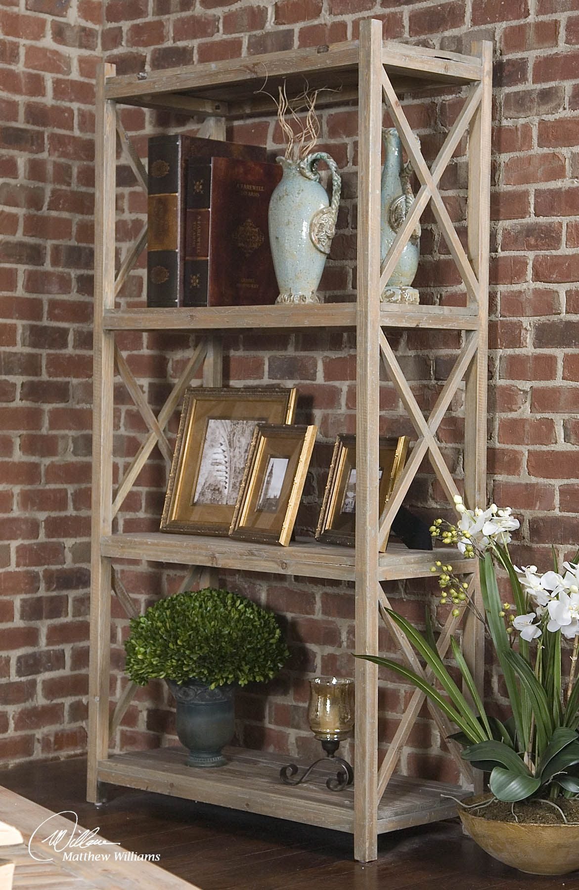 Reclaimed wood etagere with open shelving in a natural finish.