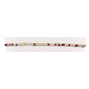 Gameday Hope Unwritten bracelet featuring a colorful seed bead pattern with gold-filled accents on stretch elastic.