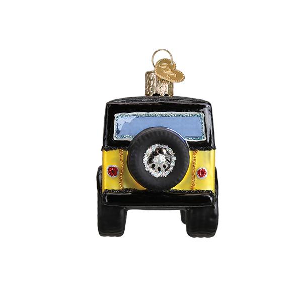 Yellow and black glass sport utility vehicle ornament with a spare tire on the back.