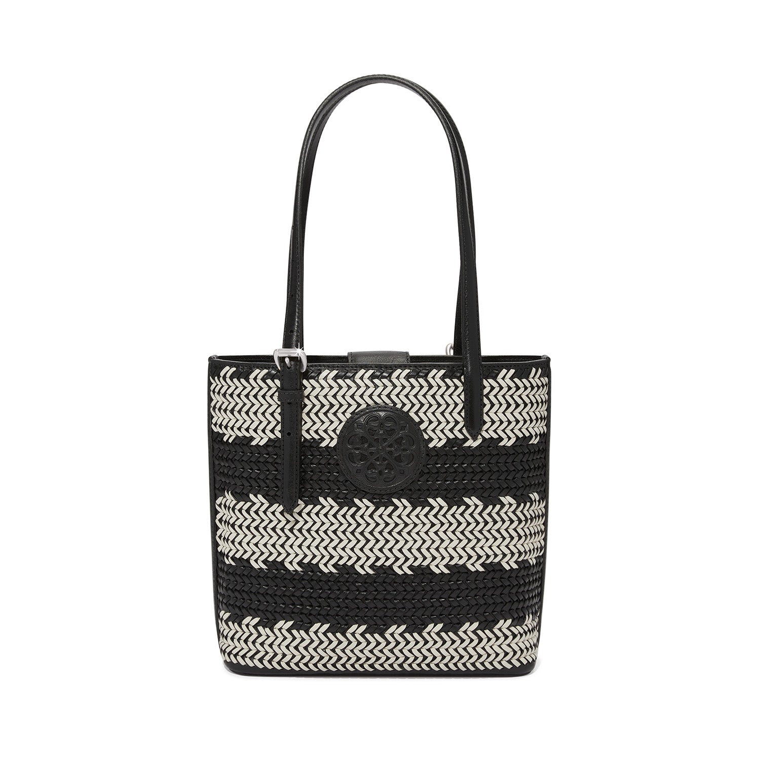 Ferrara Strata Tote in black and white woven leather with a circular medallion and shoulder straps.