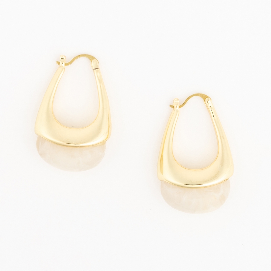 Talia gold-tone hoop earrings with a wide, curved base and a marbled cream resin accent.
