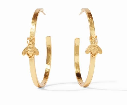 Large lightly hammered gold hoop earring with a whimsical bee accent.